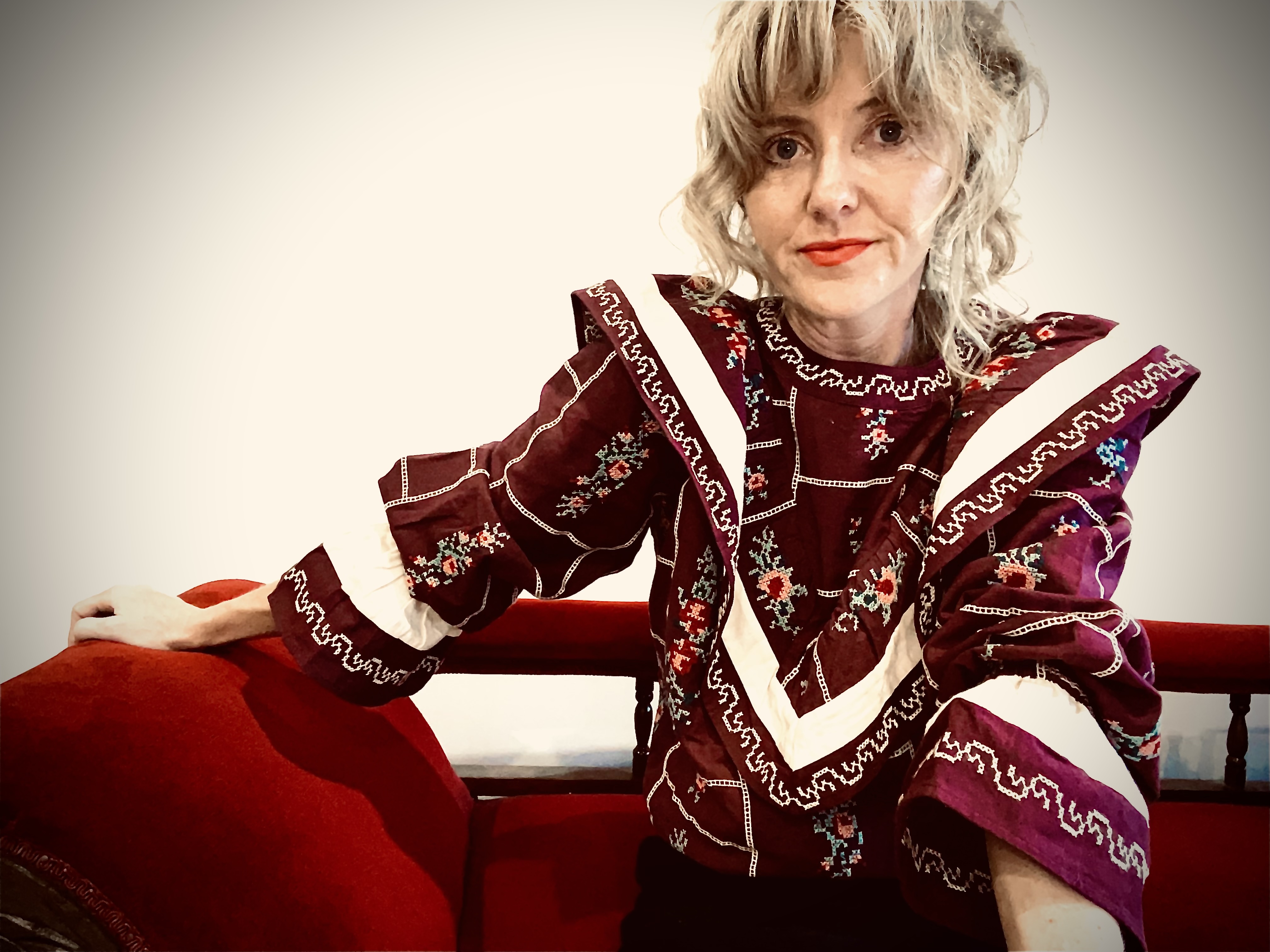 Rachael sitting on couch